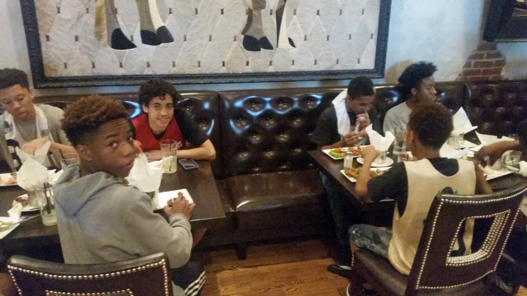 Harlem Miracles takes students-athletes out to dinner after a tournament for team building and etiquette